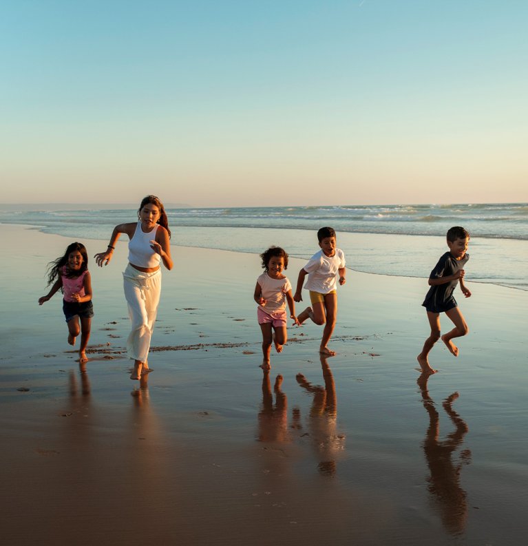 Happy family in the beach in the Algarve